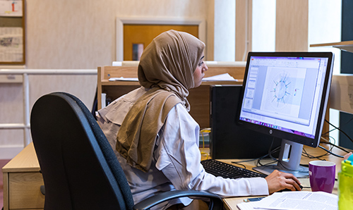 Female student using a computer