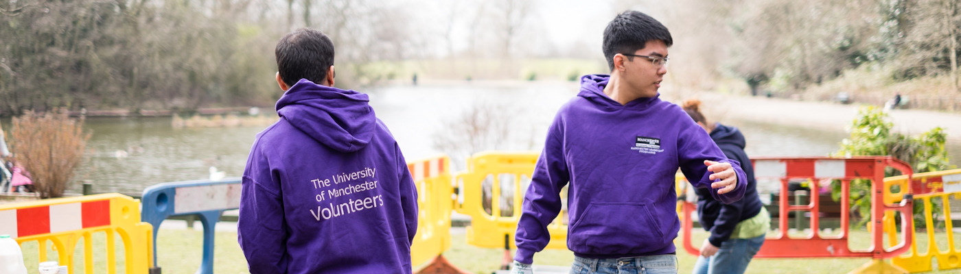 Student volunteers working on a riverbank