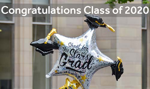 A congratulatory graduation balloon with text overlaid that says 